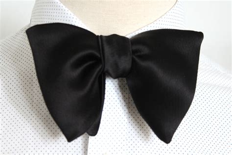 oversized black bow tie.